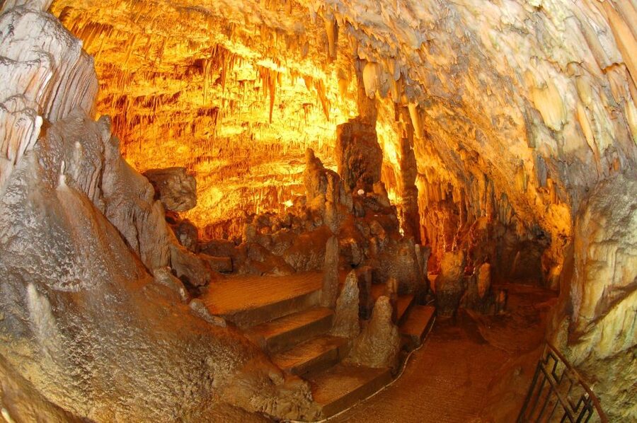Argostoli: Melissani & Drogarati Cave Tour with Wine Tasting - Melissani Cave by traditional wooden boat