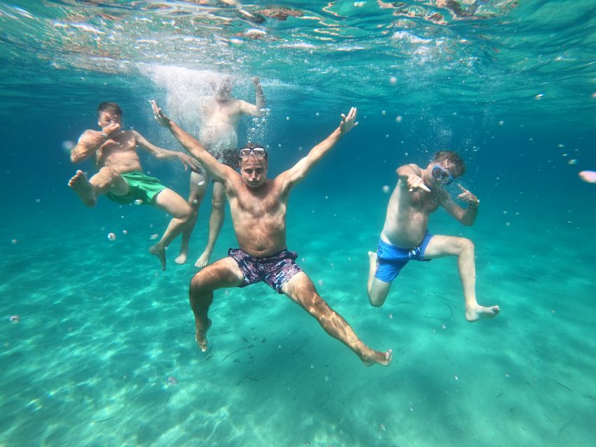 Athens: Catamaran Cruise with Fresh Lunch and Wine - Vouliagmeni Bay and the rocky coast near Voula