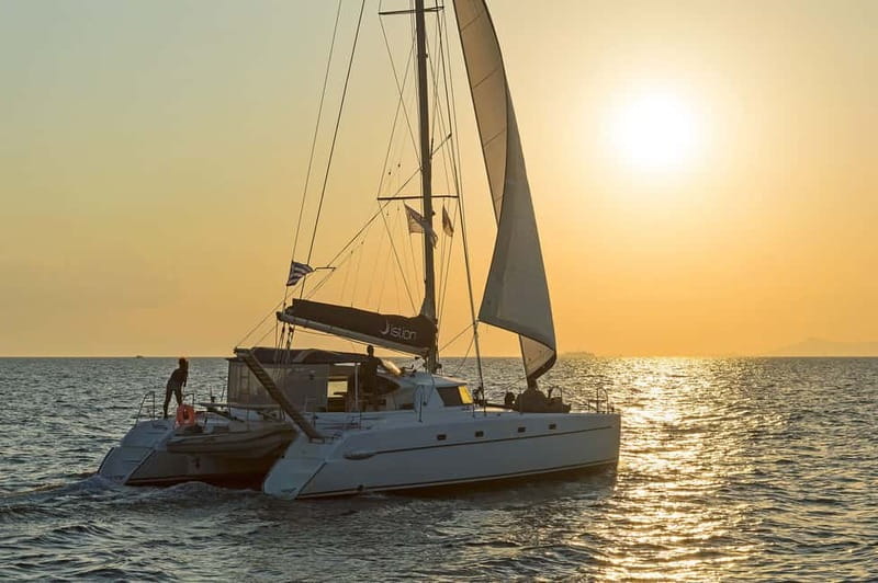 Athens: Half-Day Sunset Catamaran Cruise with Meal & Drinks - Boarding the modern catamaran from Athens