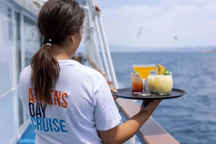 Athens: Swimming Cruise with Lunch, Wine & Live DJ on Board - The DJ and sunset change the ride home