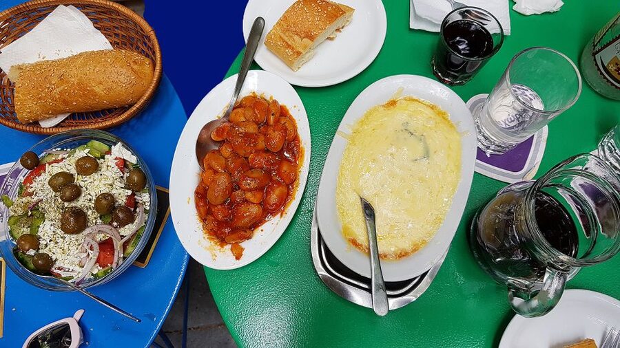 Athens: Traditional Greek food tour in hidden spots - Through Athens markets, from fish to spices