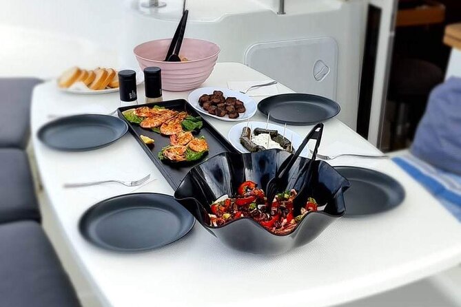 Catamaran Day & Sunset Cruises with meals Drinks and transportation - A half-day on the Aegean, with swimming at its center