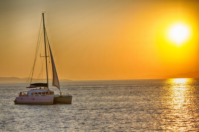 Catamaran Day & Sunset Cruises with meals Drinks and transportation - The sunset option and the return past Mykonos