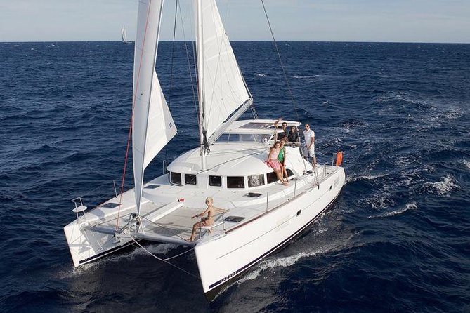 Catamaran Day & Sunset Cruises with meals Drinks and transportation - Passing BAOS and seeing Delos from the water