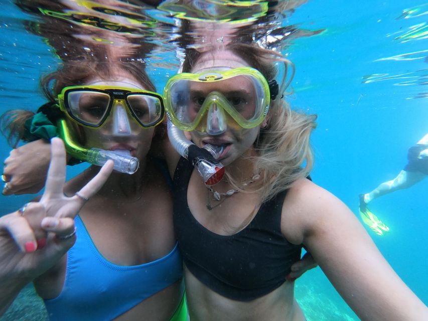 Chania: Boat Trip with Guided Snorkeling & Stand-Up Paddling - Learning stand-up paddling on the second activity stop
