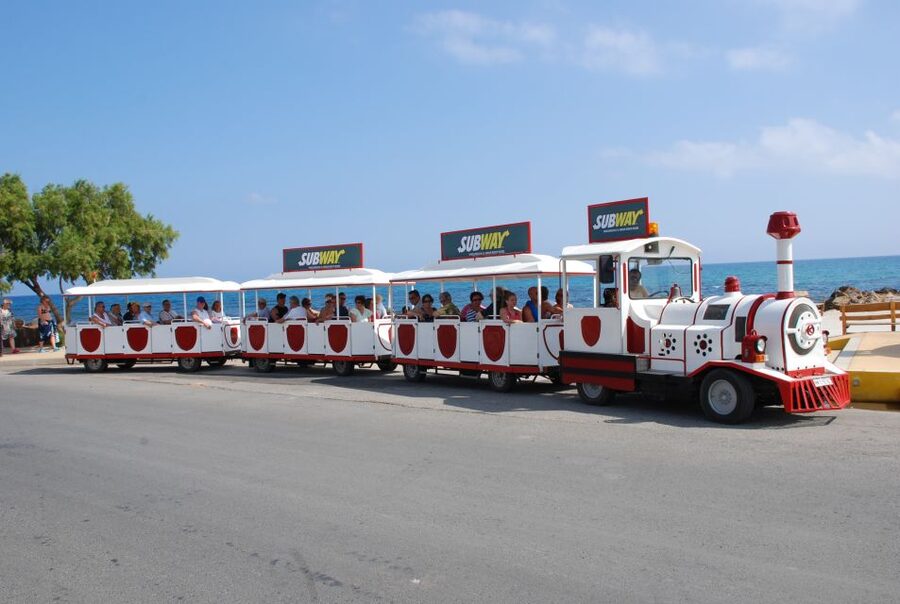 Chersonissos: Mini-Train City Highlights Tour - Boats at the port and the coastal stretch