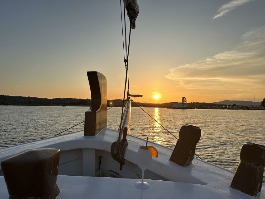 Corfu: Sunset Cruise on Classic Boat with Cocktails & Snacks - A drink, local bites, and an easygoing deck