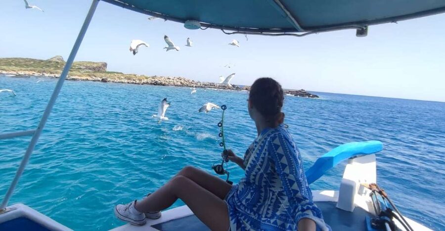 Crete: Fishing & Swimming Boat Cruise with Lunch & Drinks - Passing Spinalonga and fishing around Elounda Bay