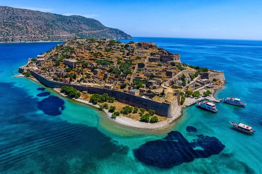 Crete: Spinalonga, Elounda, & Agios Nikolaos Boat Tour & BBQ - Elounda and the boat across Mirabello Bay