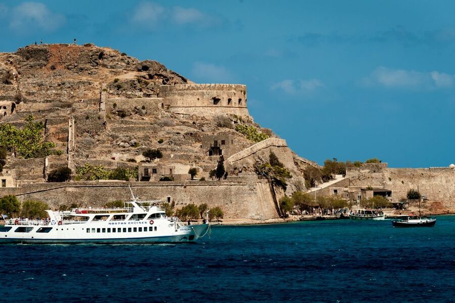 Crete: Spinalonga, Elounda, & Agios Nikolaos Boat Tour & BBQ - Walking through Spinalonga’s fortified past