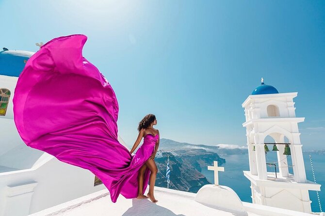 Exclusive Santorini Flying Dress Photoshoot with Pickup - Blue domes, rooftops, and Caldera views