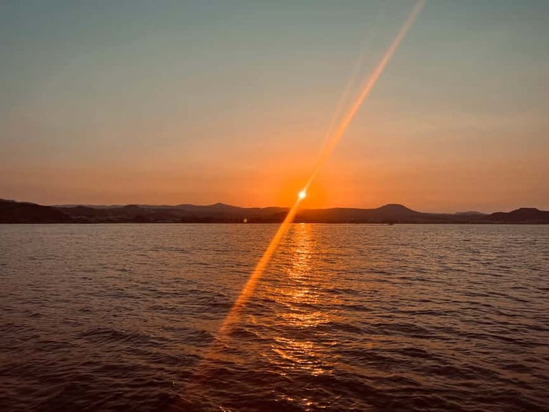 Faliraki: Sunset Cruise with Unlimited Aperol, Beers & Wine - Sailing Toward Anthony Quinn and Ladiko Bays