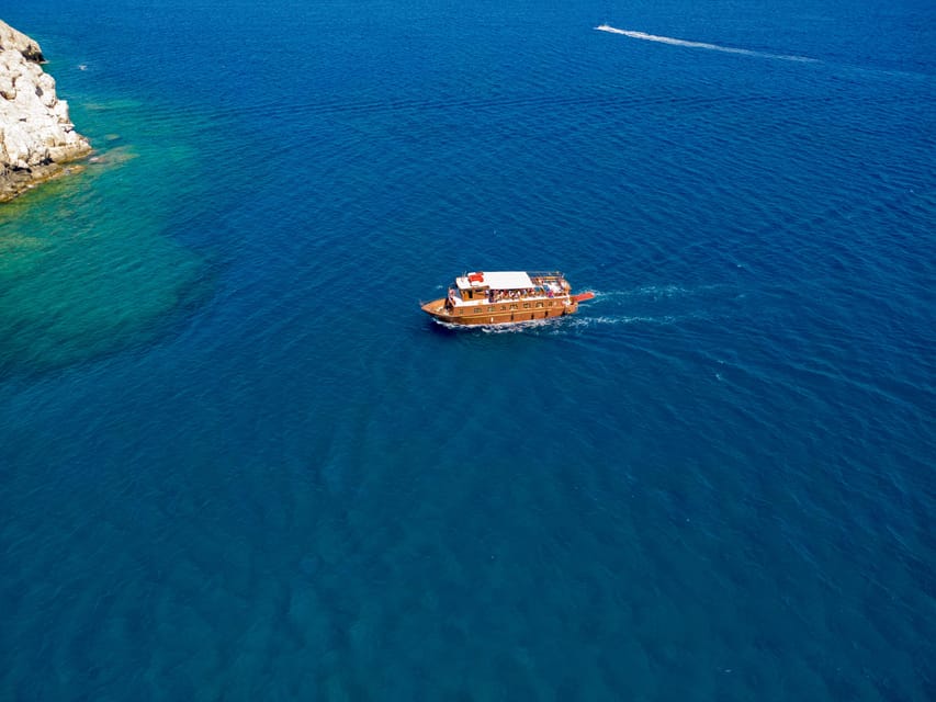 Faliraki : Transfer & Cruise to Lindos with 3 Swimming Stops - Navarone Bay: the first 25-minute swim