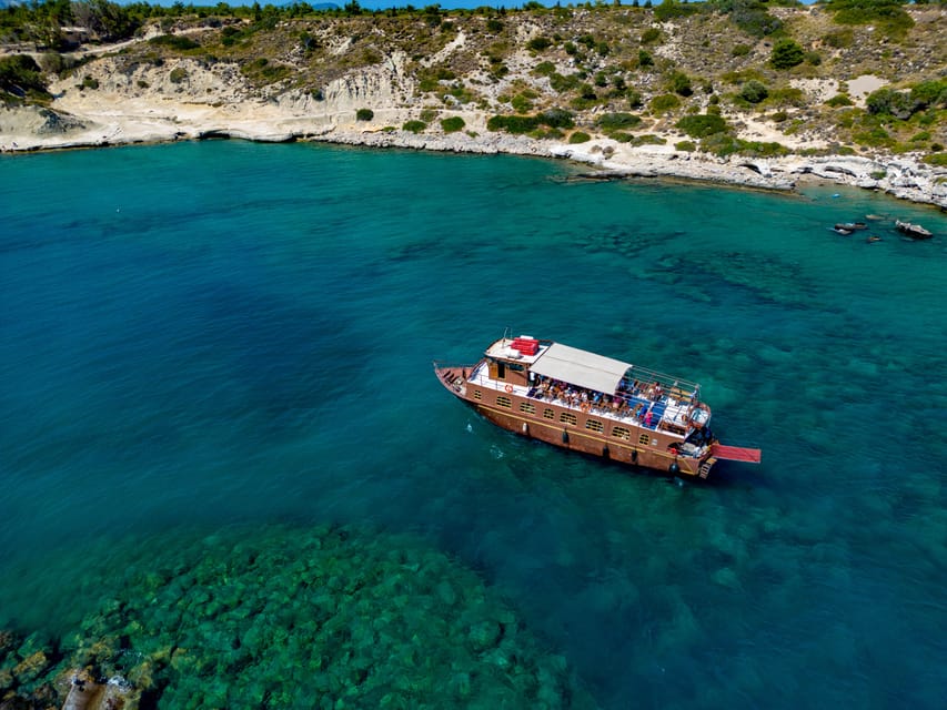 Faliraki : Transfer & Cruise to Lindos with 3 Swimming Stops - A boat ride with a simple, sunny rhythm