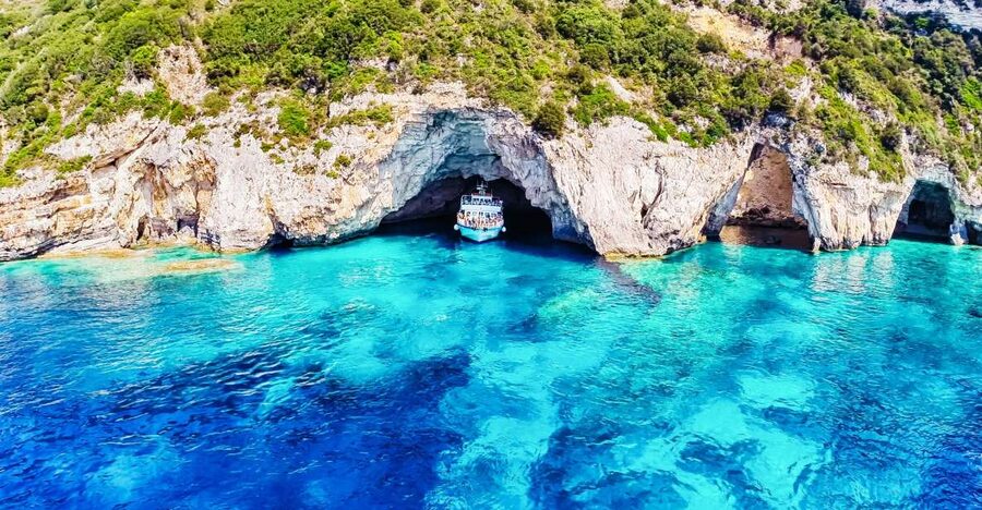 From Corfu: Day Cruise to Paxos, Antipaxos, and Blue Caves - A boat day with music, dancing, and a social mood