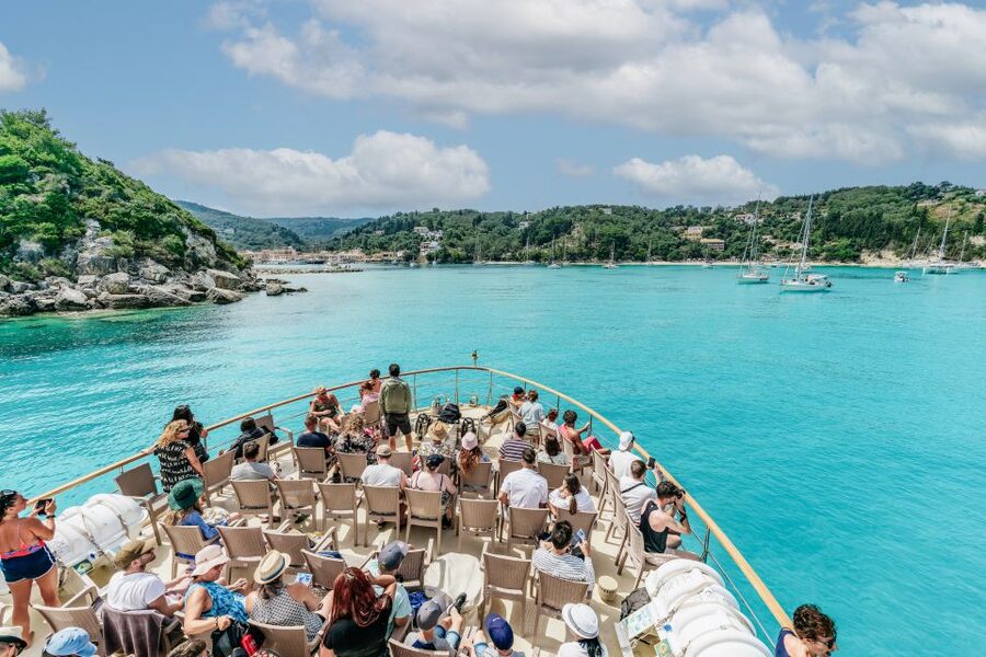 From Corfu Island: Antipaxos & Paxos Blue Caves Boat Cruise - Leaving Corfu with castle views