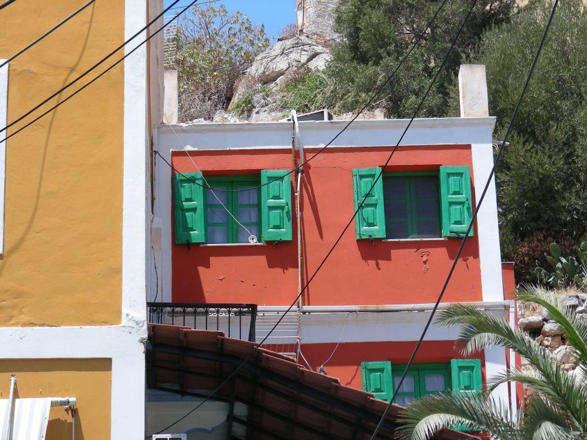 From Rhodes: Boat Trip to Symi Island with Hotel Transfer - What the guide adds to the day