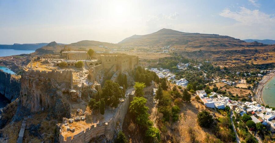 From Rhodes: Lindos Village and Acropolis Guided Tour - Walking from Lindos village to the Acropolis