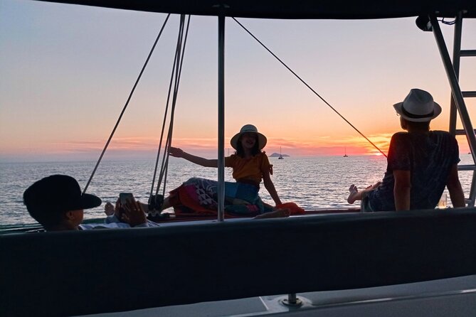 Half-Day Exclusive Catamaran Cruise in Santorini with Meal and Open Bar - The ride back past Fira and Black Mountain