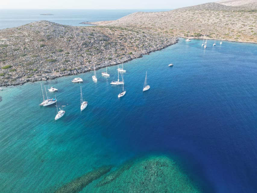 Heraklion: Sailing Cruise to Dia Island with Drinks and Meal - Dia Island: clear water, rocky hills, and a quiet beach