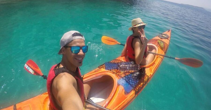Lefkada: Hidden Blue Cave Kayak Trip with Lunch & Fruits - Entering the Blue Cave through its concealed opening
