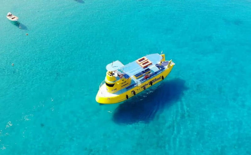 Lindos: Submarine Cruise with Swimming Stop at Navarone Bay - Feeding fish and watching local marine life