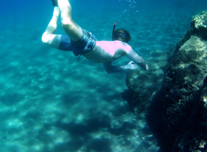 Naxos: Rhina Cave and Coastline Sea Kayaking Tour - Pickup, group size, and weather changes