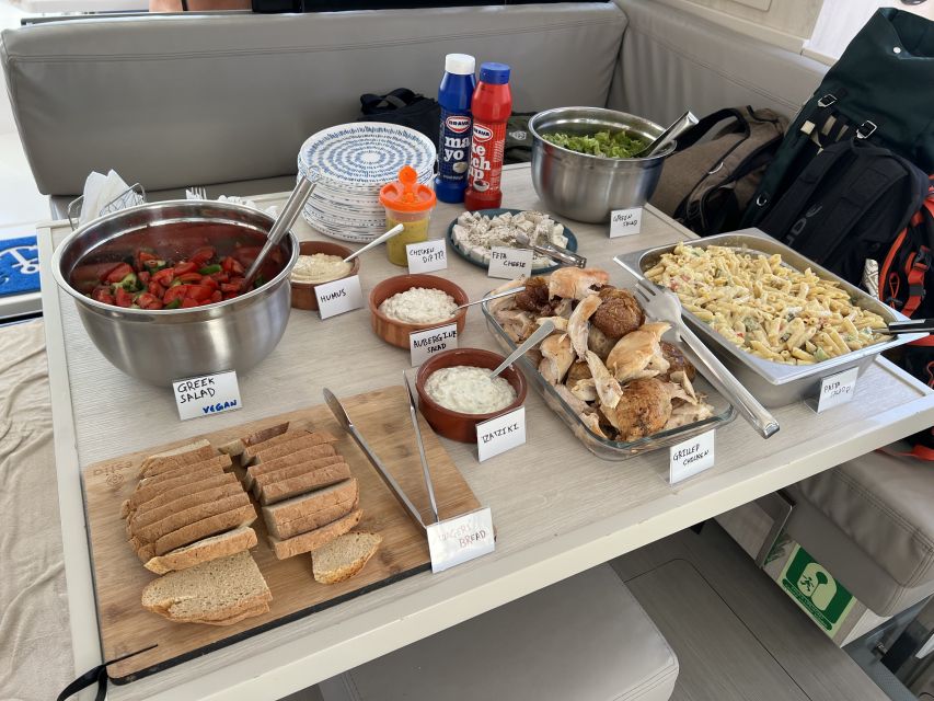 Rhodes: All-Inclusive Catamaran Cruise with Lunch and Drinks - Lunch at anchor, with Greek flavors and cold drinks