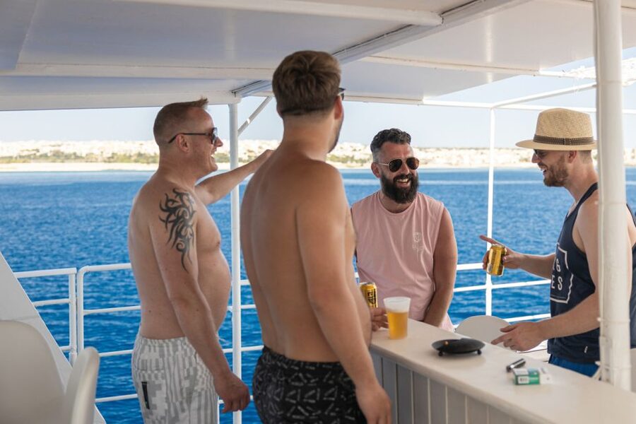 Rhodes: Bay to Bay Swim Cruise with Greek Buffet and Wine - Food, wine, music, and the Parea mood