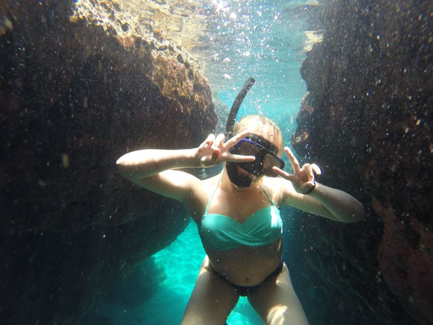 Rhodes: Beach Cruise with Swimming, Meal, & Unlimited Drinks - Leaving Rhodes Old Town at speed