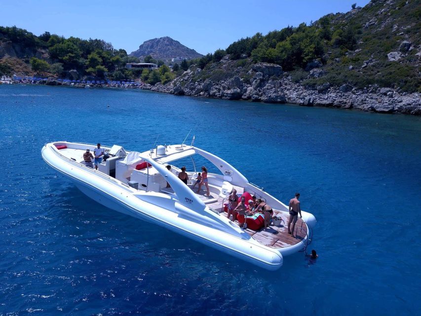 Rhodes: Beach Cruise with Swimming, Meal, & Unlimited Drinks - The boat atmosphere: luxury with a party edge