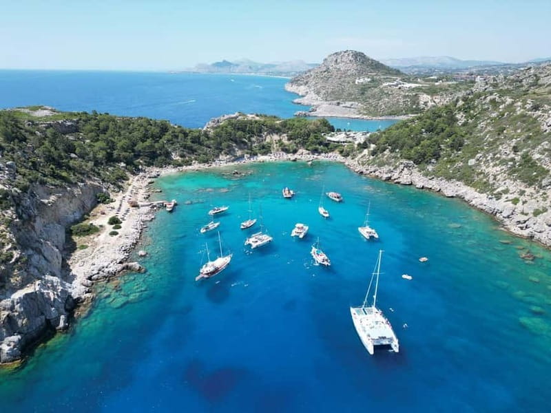 Rhodes: Cruise with 4 Swim Stops, Lunch, Drinks & Transfers - Ladiko Bay and its underwater cliff