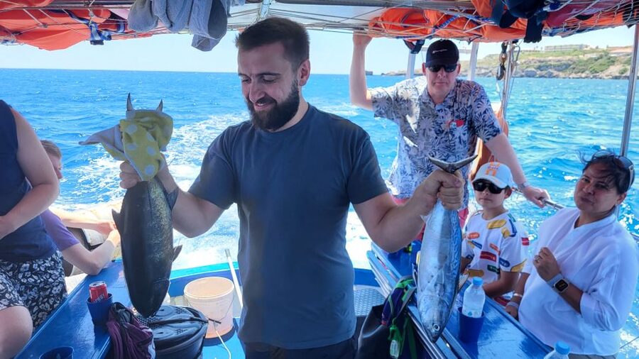 Rhodes: Fishing Trip, Snorkelling, BBQ, & Professional Guide - Swimming and snorkeling in a weather-dependent bay