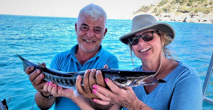 Rhodes: Fishing Trip, Snorkelling, BBQ, & Professional Guide - Trolling begins with a chance at faster fish