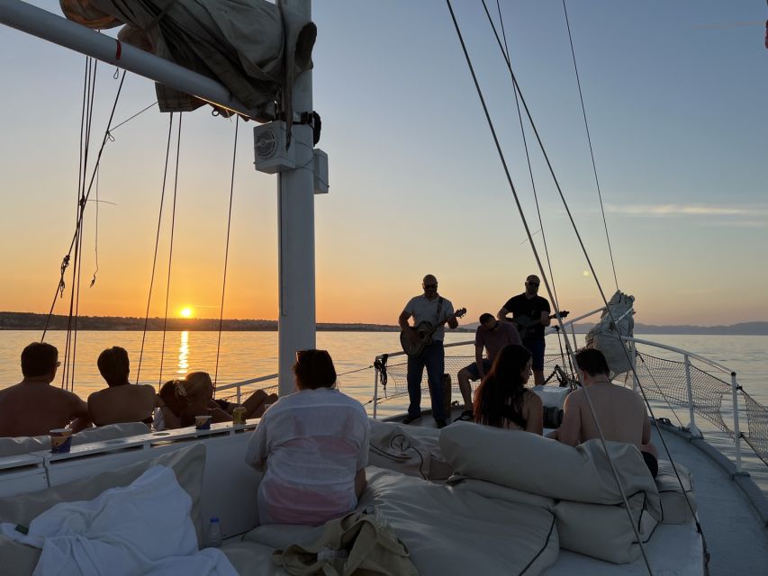 Rhodes: Sunset Cruise w/ Gourmet Buffet, Drinks & Live Music - Sunset, familiar songs, and the return to Rhodes