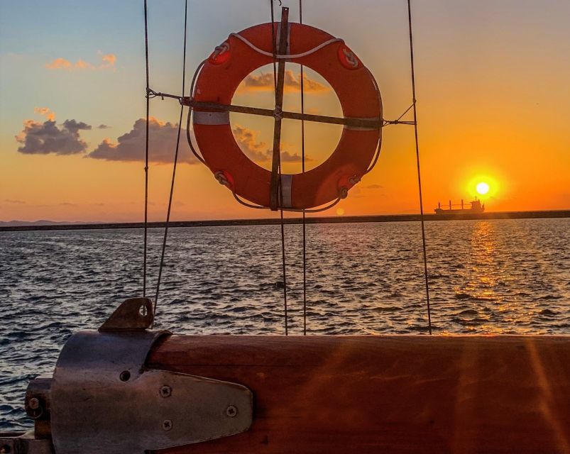 Rhodes Town: Sunset Boat Cruise with Drinks & Snacks - What the crew adds to the experience