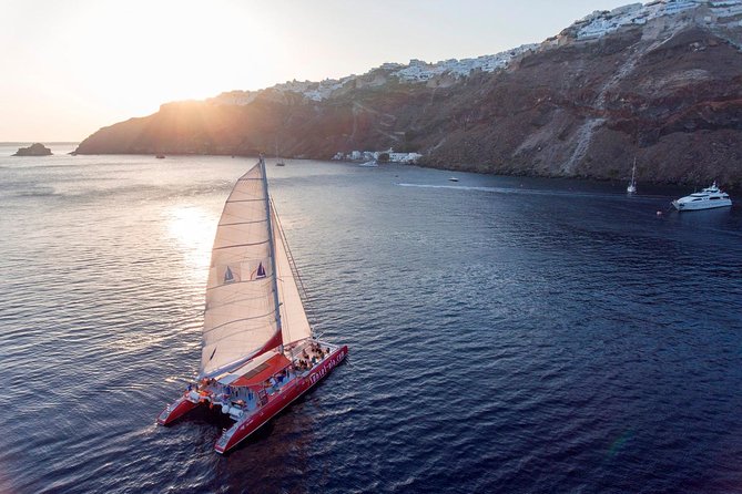 Sailing Catamaran Cruise in Santorini with BBQ, Drinks and Transfer - White Beach, swimming, and lunch