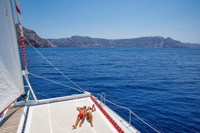 Sailing Catamaran Cruise in Santorini with BBQ, Drinks and Transfer - What the boat and crew are like