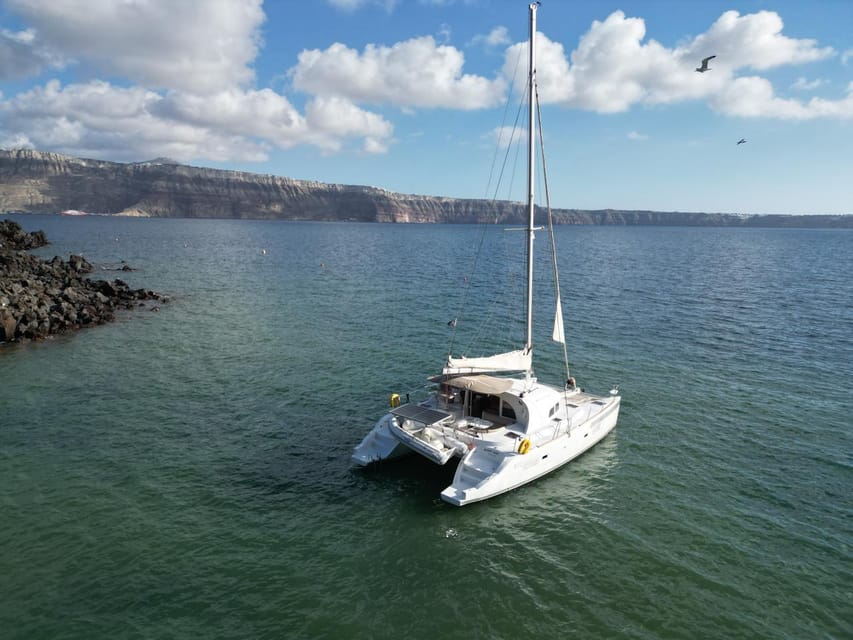 Santorini: Catamaran Cruise with Greek BBQ and Drinks - Mesa Pigadia for a quieter final swim
