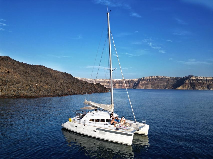 Santorini: Catamaran Cruise with Greek BBQ and Drinks - A small boat feel, with room to relax