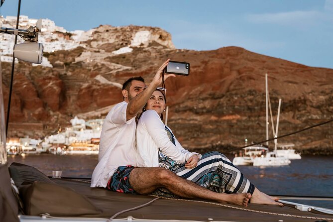 Santorini Catamaran Cruise with Greek Meal, Open-Bar and Sunset - Crew service, music, and comfort