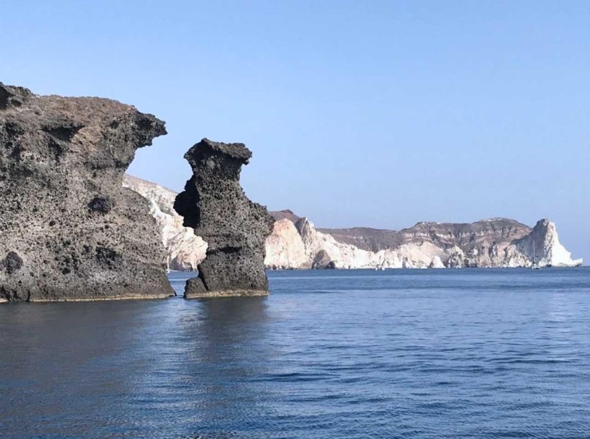 Santorini: Luxury Caldera Cruise with Full Greek Meal - Santorini from the water at sunset