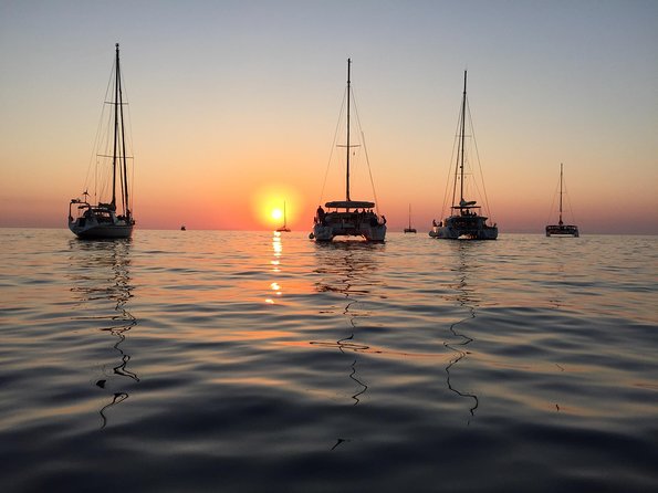 Santorini Luxury Catamaran Sunset Cruise with BBQ, Drink and Transfer - Swimming near the Hot Springs