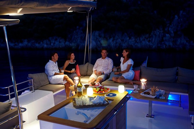 Santorini Luxury Catamaran Sunset Cruise with BBQ, Drink and Transfer - Red Beach from the water