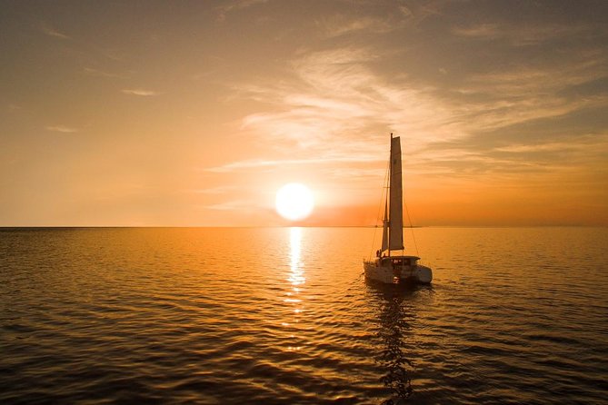Santorini Luxury Catamaran Sunset Cruise with BBQ, Drink and Transfer - The sunset finale