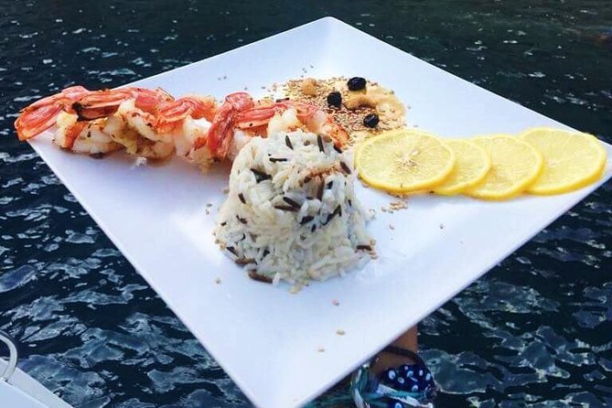 Santorini Luxury Catamaran Sunset Cruise with BBQ, Drink and Transfer - Sailing past the Volcano and Palea Kameni