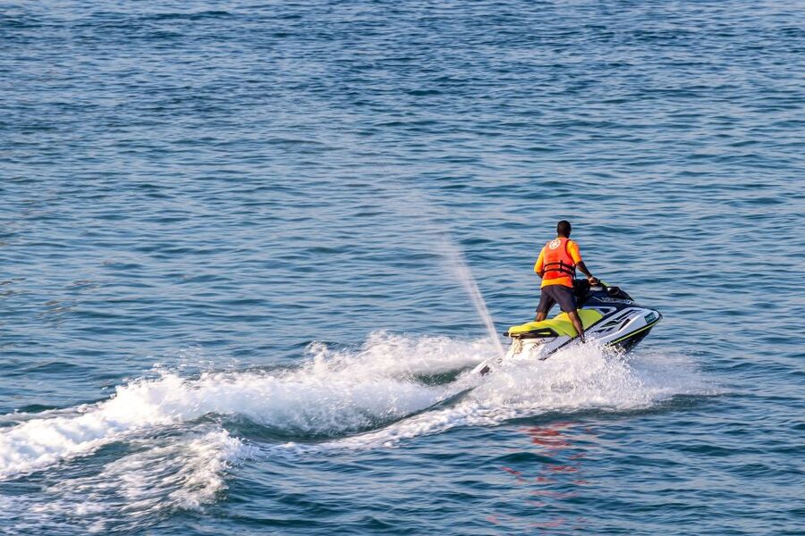 Santorini: Perivolos Beach Jet Ski Rental - Riding a Yamaha Sport jet ski along the coast