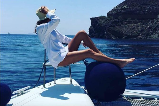 Santorini Platinum Catamaran Cruise with Meal, BBQ and Open Bar - The lighthouse and caldera views come between the swims