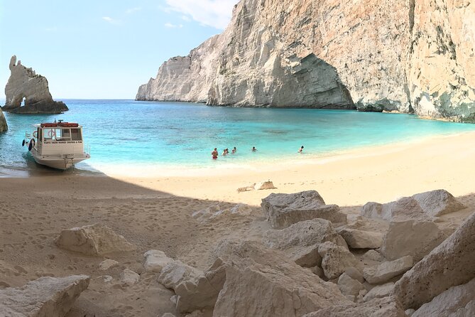 Zakynthos boat tour:Shipwreck& Local blue caves with 3 Swim Stops - Three swim stops in clear Ionian water